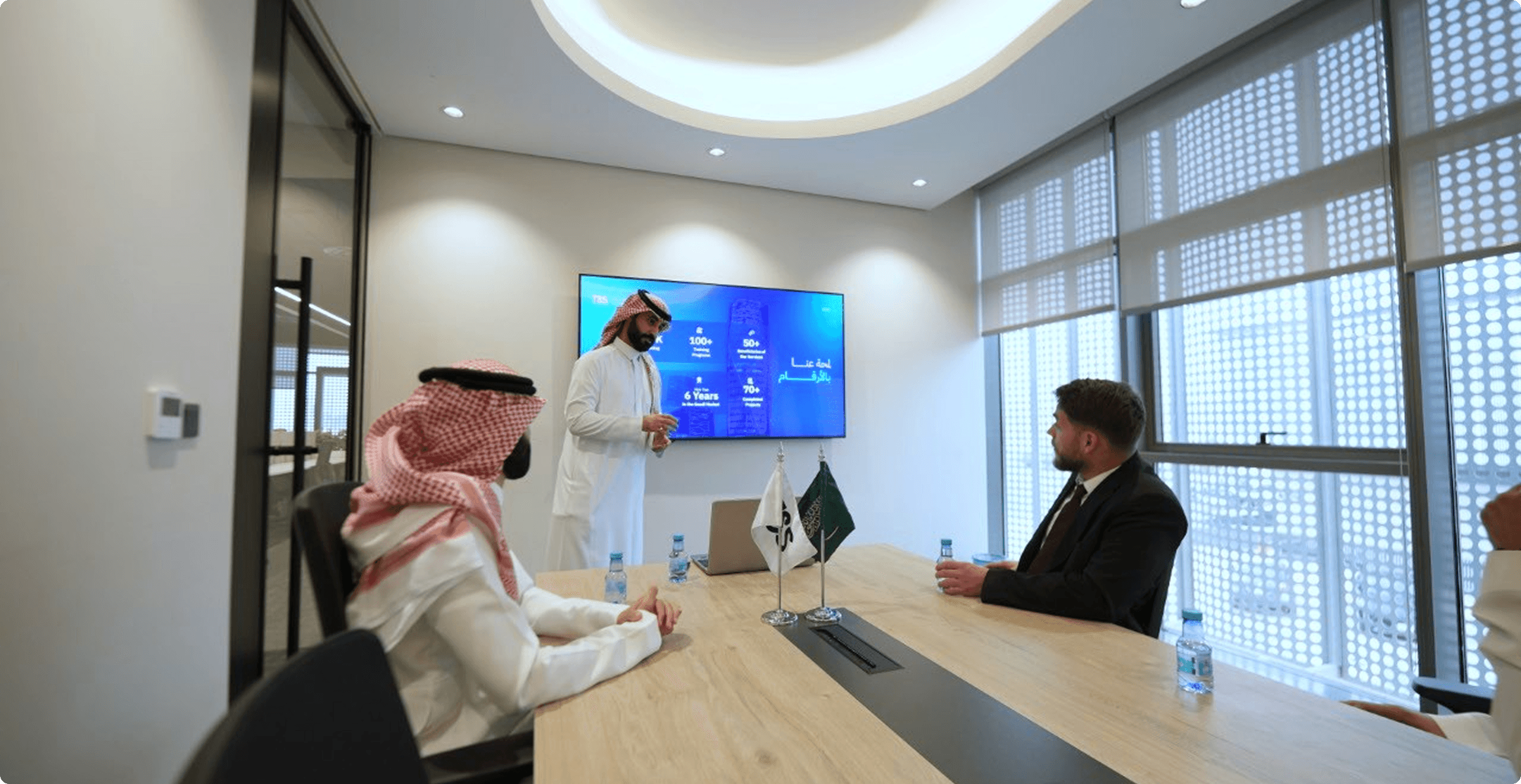 Saudi professionals working through a practical learning exercise